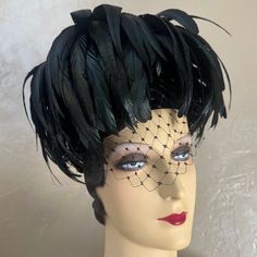 This Is A Sample Of The Most Fashionable Millinery Creations Using Iridescent Rooster Feathers, The Hat Consists Ion A Round Structure That Sits On Top Of The Head. From The Top There Is A Voluminous Cascade Of Long Black Rooster Feathers That Frame The Face And Head. At The Top Center, There Is A Small Rhinestone Jewel. There Is Also A Black Demi-Veil. In The 1950s, Hat Designers Made Hats That Covered Up The Entire Head. They Were Covered In Feathers, Fur, Flowers, Or Manipulated Fabrics. Thes 1950s Hat, Black Rooster, Rooster Feathers, Feather Hat, Long Black, Veil, Rooster, Feathers, The Face