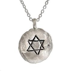 Description and Details Wear the Star of David close to your heart with this stunning, hand-sculpted pendant, which is imprinted with texture from stones of the Western Wall in Jerusalem. The sterling silver pendant hangs on a 16” traditional chain for a beautiful look that can be worn every day, or layered with your other favorite necklaces. Pendant 5/8″ (14mm) Sterling silver circle pendant Star of David engraving Imprint with texture from the stones of the Western Wall in Jerusalem Chain leng Artisan Hand Cast Sterling Silver Necklace, Sterling Silver Star Of David For Jewelry Making, Spiritual Hand Forged Medallion Necklaces, Symbolic Hammered Necklace As Gift, Spiritual Hand Forged Medallion Necklace, Symbolic Hammered Necklaces As Gift, Symbolic Hammered Necklace For Gift, Symbolic Star-shaped Engraved Necklaces, Symbolic Sterling Silver Necklace