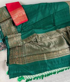 Item: Green Tussar Silk Banarasi Saree with Antique Zari Border and Palla Color:  Sea Green Material: Tussar Silk Saree length:5.5 meters  Saree comes with unstitched blouse piece  Design: Our skilled artisans have meticulously woven this saree using the finest tussar silk, renowned for its rich texture and natural sheen. The lustrous green hue gracefully drapes around you, creating an aura of elegance and sophistication. Occasion: This saree is a perfect choice for weddings, festive celebration Slub Silk Traditional Wear With Dupatta For Puja, Slub Silk Dupatta For Puja, Festive Green Anarkali Set With Zari Weaving, Anarkali Slub Silk Dupatta For Puja, Anarkali Style Slub Silk Dupatta For Puja, Green Traditional Anarkali Set For Puja, Festive Slub Silk Traditional Wear For Ceremonies, Green Chanderi Sets With Zari Weaving, Green Chanderi Anarkali Set With Zari Weaving