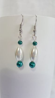 These simple but elegant earrings and the perfect completion for a night out. Turquoise Drop Earrings For Formal Occasions, Turquoise Earrings For Evening, Elegant Green Nickel-free Clip-on Earrings, Nickel-free Turquoise Earrings For Party, Turquoise Pearl Drop Earrings, Elegant Turquoise Pearl Drop Earrings, Elegant Turquoise Beaded Earrings For Party, Elegant Turquoise Hoop Earrings, Elegant Turquoise Hypoallergenic Hoop Earrings