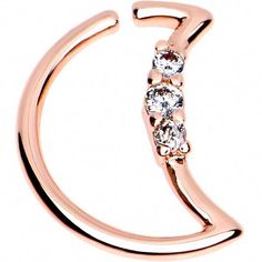 a rose gold ring with three stones on it