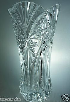 a clear glass vase sitting on top of a table