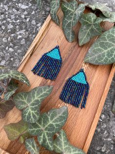 Royal shiny blue beaded earrings - Indigo small dangle earrings - Feather seed bead earrings - Native style earrings - Boho/bohemian/ethnic ♥𝑇ℎ𝑒 𝑝𝑎𝑡𝑡𝑒𝑟𝑛 𝑜𝑓 𝑡ℎ𝑖𝑠 𝑒𝑎𝑟𝑟𝑖𝑛𝑔 𝑖𝑠 𝑐𝑟𝑒𝑎𝑡𝑒𝑑 𝑏𝑦 𝐾𝑎𝑍𝑒𝐵𝑒𝑎𝑑𝐽𝑒𝑤𝑒𝑙𝑟𝑦 ♥𝑀𝑎𝑑𝑒 𝑢𝑠𝑖𝑛𝑔 𝑓𝑟𝑒𝑒ℎ𝑎𝑛𝑑 𝑏𝑒𝑎𝑑𝑖𝑛𝑔 𝑤𝑜𝑣𝑒𝑛 𝑡𝑒𝑐ℎ𝑛𝑖𝑞𝑢𝑒𝑠 𝑤𝑖𝑡ℎ 𝑠𝑡𝑟𝑜𝑛𝑔 𝑠𝑦𝑛𝑡ℎ𝑒𝑡𝑖𝑐 𝑡ℎ𝑟𝑒𝑎𝑑. ♥𝑇ℎ𝑒 𝑠𝑖𝑧𝑒 𝑜𝑓 𝑡ℎ𝑒 𝑠𝑒𝑒𝑑 𝑏𝑒𝑎𝑑𝑠 𝑢𝑠𝑒𝑑 𝑖𝑠 2 𝑚𝑖𝑙𝑙𝑖𝑚𝑒𝑡𝑒𝑟𝑠 𝑎𝑛𝑑 𝑏𝑒𝑎𝑑𝑠 𝑎𝑟𝑒 ℎ𝑖𝑔ℎ 𝑞𝑢𝑎𝑙𝑖𝑓𝑖𝑒𝑑. ♥𝐴𝑙𝑙 𝑡ℎ𝑒 ℎ𝑜𝑜𝑘𝑠 𝑢𝑠𝑒𝑑 𝑖𝑛 𝑜𝑢𝑟 𝑗𝑒𝑤𝑒𝑙𝑟𝑦 𝑎𝑟𝑒 24 𝑘 𝑔𝑜𝑙𝑑 𝑝𝑙𝑎𝑡𝑒𝑑 𝑎𝑛𝑑 ℎ𝑦𝑝𝑜𝑎𝑙𝑙𝑒𝑟𝑔𝑒𝑛𝑖𝑐. ♥𝑇ℎ𝑒𝑠𝑒 𝑎𝑟𝑒 𝑣𝑒𝑟𝑦 𝑙𝑖𝑔ℎ𝑡 𝑒𝑎𝑟𝑟𝑖𝑛𝑔𝑠 𝑡ℎ𝑎𝑡 𝑦𝑜𝑢 𝑐𝑎𝑛 𝑤𝑒𝑎𝑟 𝑎𝑙𝑙 𝑑𝑎𝑦 𝑤𝑖𝑡ℎ𝑜𝑢𝑡 ℎ𝑢𝑟𝑡𝑖𝑛𝑔 𝑦𝑜𝑢𝑟 𝑒𝑎𝑟! The on Blue Bohemian Earrings With Dangling Beads, Bohemian Blue Earrings With Dangling Beads, Blue Tiny Beads Earrings For Festivals, Blue Bohemian Beaded Earrings For Pierced Ears, Blue Earrings With Tiny Beads As A Gift, Blue Tassel Earrings For Festivals, Handmade Blue Earrings For Festivals, Unique Blue Earrings For Festival, Turquoise Earrings With Tiny Beads For Festivals