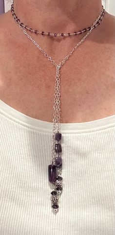 Amethyst and sterling silver featured in this lariat style handcrafted necklace. Approximately 43 inches in length.  Length shortens considerably when wrapped around neck to an adjustable size. Sterling Silver Multi-strand Jewelry With Adjustable Chain, Artisan Silver Lariat Necklace In Sterling Silver, Handmade Artisan Silver Lariat Necklace, Artisan Handmade Silver Lariat Necklace, Adjustable Dangle Lariat Necklace, Adjustable Sterling Silver Crystal Necklace, Silver Artisan Lariat Necklace For Gift, Sterling Silver Pendant Jewelry With Adjustable Length, Artisan Silver Lariat Necklace For Gift