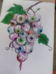 a drawing of grapes with eyeballs on it