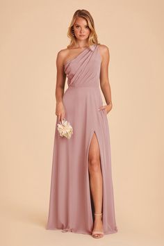 a bridesmaid wearing a one shoulder dress with thigh high slit and side split