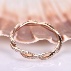 a close up view of a gold ring with diamonds on it's sides and in the middle