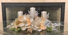 a glass table topped with candles and flowers