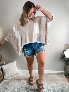 It's the care-free look you've been searching for! Made of a lightweight material and contrast details, this top is made with our texture-loving queens in mind! Get ready for playful patchwork, monochromatic colorways, ribbing, and crochet elements - this piece is truly one-of-a-kind! Fits oversized; Bethany is 5'4" 175lb and wearing a medium.AVAILABLE IN MORE COLORS!Pair it with one of our Basic Tanks or bramis!Complete the look with our Alaina Denim Shorts, Blowout Platform Sandals. and Rhinestone Cross Necklace. Material: Self - 94% Rayon 6% SpandexContrast - 60% Polyester 30% Rayon 10% Spandex Patchwork Short Sleeve Top For Vacation, Short Sleeve Patchwork Top For Vacation, Beige Patchwork Tops With Relaxed Fit, Beige Patchwork Top With Relaxed Fit, Beige Relaxed Fit Patchwork Tops, Beige Patchwork Tops For Summer, Patchwork Short Sleeve Blouse For Layering, Oversized Patchwork Tops For Layering, Casual Beige Patchwork Tops