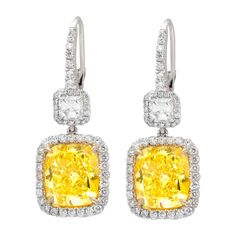 Platinum and 18kt yellow gold fancy yellow diamond earrings, features 10.76ct of two radiant diamonds fly-fy vs and 2.00ct of two ascher cuts diamonds and micropave rd diamonds all around. Yellow Diamond Earrings, Yellow Diamond Earring, Platinum Earrings, Fancy Yellow Diamond, Diamond Dangle Earrings, Diamond Earring, Yellow Earrings, Expensive Jewelry, Fancy Diamonds