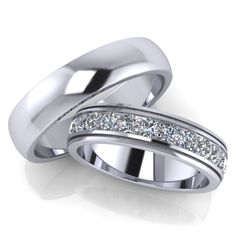 two white gold wedding bands with channeled diamonds on each side, set in 18k white gold