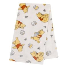 The oh-so-soft Winnie the Pooh Blanket will be a favorite for your baby to cuddle! The blanket features an allover print of Winnie the Pooh and his honey pot on a buttery ivory background. Measuring 30" x 36", this is the perfect size for use in the nursery or to take on the go. Made from easy care 100% polyester plush fabric, machine washable. The neutral unisex design makes this a great shower gift for baby boys and girls alike at a great value! Coordinates with the Disney Winnie the Pooh Infa Disney Baby Nurseries, Winnie The Pooh Blanket, Pooh Plush, Plush Baby Blankets, Winnie The Pooh Plush, Ivory Background, Infant Girl, Baby On The Way, Plush Fabric