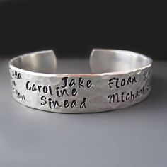 Personalized Mother's Cuff * Children's Names * Hand Stamped Give a one of a kind beautiful handcrafted bracelet with the names of your children or grandchildren. Include your own personal message on the inside. WHAT TO INCLUDE WITH YOUR ORDER: 1. The NAMES you want stamped on the cuff. All names will be stamped on the OUTSIDE of the cuff unless other instructions are provided. ( MAXIMUM OF 10 Names) CUFF DETAILS: * The TOP of the cuff is stamped with your choice of names. This cuff can hold app