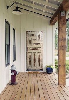 the front porch has a fire hydrant on it