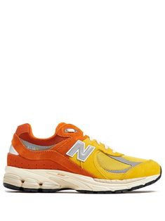 lava orange/canary yellow panelled design suede panelling mesh panelling logo patch to the side logo patch at the tongue perforated detailing almond toe front lace-up fastening branded insole chunky rubber sole When buying this unisex item, keep in mind that it is graded in standard men's sizing. New Balance 2002, New Balance 2002r, Shoes Orange, Creative Room, Versace Outfit, Chanel 2, Canary Yellow, Iconic Bags, New Balance Shoes