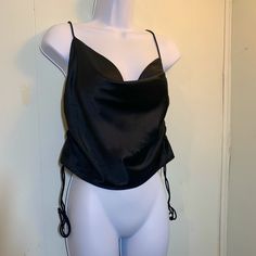 Size: 4 (Shein Small) Material: 97% Polyester 3% Elastane Color: Black Style: Cow Neck, Halter And Drawstring Seams To Crop Hem, Camisole, Sleek, Sexy, Cocktail, Neutral Brand: Shein Condition: Excellent Never Worn **Approx. Meas. - Size: 4 (Shein's Size S) -Bust/Pit To Pit: 15" -Full Top Front Length: 13" -Full Top Back Length: 8.5" -Waist/Hem Opening Length: 16.5" -Drawstring Seam Length: 7.5" -Straps: 39" **Mannequin Is Size Small 5/6 Everything Must Go! Always Open To Reasonable Offers! Solid Color Tank Top For Party, Solid Color Top With Built-in Bra For Evening, Evening Cami Tops With Built-in Bra, Solid Color Cami Top For Night Out, Evening Camisole Tops With Built-in Bra, Fitted Tank Blouse For Night Out, Black Party Tops With Built-in Bra, Black Camisole Crop Top For Evening, Elegant Black Tank Crop Top