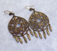 This is a gold tone pair of dangle earrings with Victorian style design. Store Notes - This is the exact item you'll receive!  - USPS first class within 1 business day of purchase.  - Items are packaged in a jewelry box unless they are too big.  - Open to best offer - If you have any questions please ask! Thanks Tags Vintage Dangle Earrings, Victorian Dangle Earrings, Dangling Earrings, Drop Earrings, Gold Tone Earrings, Baroque Earrings Baroque Earrings, Victorian Earrings, Earrings Dangling, Drop Earrings Gold, Earrings Drop, Dangling Earrings, Victorian Style, Victorian Fashion, First Class