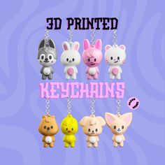 the keychais are designed to look like animals and have pink letters that read 3d printed