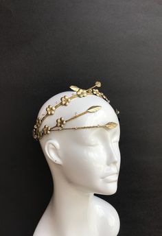 This truly luxurious headpiece made entirely by hand from delicate Italian gold leather. Ornately decorated with an array of beautiful floral appliqués and stunning Swarovski crystal and beads. Extremely light and comfortable to wear.  Looks amazing from any angle! Perfect wether you a wedding guest or a bride herself. Perfect accessory for New Years Eve party! Created for powerful goddess in mind.  Wear yours with confidence. Wedding Floral Crown, Boho Wedding Crown, Powerful Goddess, Swarovski Tiara, Leather Crown, Floral Crown Wedding, Crystals Wedding, Wedding Halo, Decorative Hair Combs