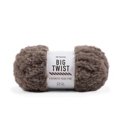 a ball of yarn that is brown and has the words, big twist on it