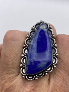 Large genuine aqua blue Lapis Lazuli Vintage ring Low content silver not sterling. Size 7.5 Can be re sized.  My jeweler charges $20 All rings are shipped in a nice gift box.   Check out our over a THOUSAND great reviews Engraving is $4 per letter and is not always perfect depending on the piece. It can take a few days if the jeweler is busy. This is payable to Paypal Judithsltd@gmail.com Nickel-free Blue Turquoise Sterling Silver Ring, Nickel-free Sterling Silver Turquoise Ring, Nickel-free Blue Turquoise Ring In Sterling Silver, Blue Gemstone Ring Jewelry, Blue Spiritual Open Ring Jewelry, Spiritual Blue Open Ring Jewelry, Blue Turquoise Ring With Large Stone In Sterling Silver, Blue Turquoise Ring With Large Stone For Anniversary, Anniversary Blue Turquoise Ring With Large Stone