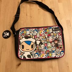 Nwt Tokidoki Messenger Bag Featuring Mozzarella And Friends (Aka, The Moofia!) *Tokidoki Messenger Bag *One Main Zipped Compartment, Adjustable Shoulder Strap *Inside Pocket For Valuables *Matte Black Pu Fabric With An All-Over Tokidoki Print On The Front *Approx Dimensions: 39.8 X 26.4 X 3.4 Cm Kawaii Multicolor Bag With Adjustable Strap, Playful Satchel Shoulder Bag For School, Kawaii Multicolor Rectangular Bag, Playful Shoulder Bag With Adjustable Strap For School, Cute Multicolor School Satchel, Kawaii Multicolor Bags For Everyday Use, Everyday Kawaii Black Shoulder Bag, Kawaii Black Shoulder Bag For Everyday, Kawaii Multicolor Rectangular Shoulder Bag