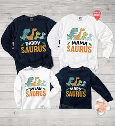 Family Matching Long Sleeve Tops With Cartoon Print, Blue Dinosaur Print Long Sleeve Top, Blue Long Sleeve Dinosaur Print Top, Long Sleeve Blue Top With Dinosaur Print, Long Sleeve Cotton Tops With Dinosaur Print, Cotton Long Sleeve Tops With Dinosaur Print, Long Sleeve Cotton Top With Dinosaur Print, Blue Long Sleeve Top With Dinosaur Print, Unisex White Top With Dinosaur Print