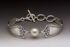 a white bracelet with pearls on it