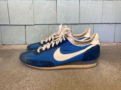 --  Vintage 1980s Nike Oceania Dark Blue Sneakers  --  Good overall condition with some wear and staining --  Made in Taiwan --  Dated 1981 --  Stamped size 9.5 --  Soles are very stiff --  Sold as is and for display only --  Size Men's size 9 1/2, but please see below for exact measurements --  Thanks for looking and be sure to check out my other items! MEASUREMENTS Height (From Top to Bottom of Heel) - 4 1/8 inches Width (At Widest Point) - 3  7/8 inches Length (From Toe to Back of Boot) - 11 3/8 inches Blue Sneakers, Tie Shoes, Tennis Shoes, Athletic Shoes, Dark Blue, Shoes Sneakers, Lace Up, Electronic Accessories, Purses And Bags