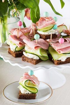 cucumber, ham and cheese appetizers on crackers