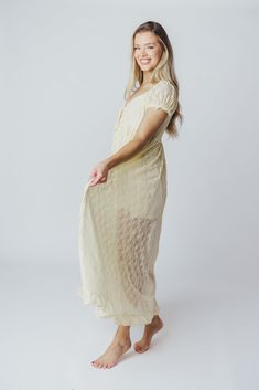 Slip on this maxi dress for an instantly-elevated outfit - the Lindsey is all lace and no fuss. We love its delicate vintage lace overlay, combined with a sweetheart neckline and puffed sleeves. It's a beautiful, feminine choice for any occasion! Available in two colorways. FIT: Runs true to size. MATERIAL: Self: 90% Nylon, 10% Spandex; Lining: 100% Rayon. GARMENT DETAILS: Lightweight maxi dress with an inverted empire waist silhouette. Features a low sweetheart neckline, ruffled short sleeves, and a self-tie ribbon accent at the bust. Finished with a flounced ruffled hem, and smocked back panel. Partially lined with mini-skirt length lining. SIZE GUIDE: S (2-4) / M (6-8) / L (10-12) MODEL DETAILS: Mackenzie - Size S Heather - Size S Molly - Size XL Our Brunette Misses Model Our Blonde Mis Delicate Lace V-neck Dress For Brunch, V-neck Lace Maxi Dress With Ruffles, Feminine Delicate Lace Dress For Brunch, Flowy Lace Dress For Garden Party, Feminine Wedding Maxi Dress With Lace Sleeves, Lace Trim Maxi Dress For Brunch, Cream Scalloped Lace Spring Dress, Chic Dress With Delicate Lace, Chic Delicate Lace Dresses