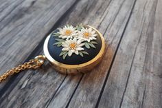 Mothers Day Locket Necklace, Mothers Day Gift, Mothers Day Keepsake FREE FEDEX priority shipping takes: 2-3 WORKDAYS ( USA). This is a vintage style, unique, handmade, polymer clay locket necklace with edelweiss flowers motif. This beautiful romantic, photo locket necklace is a piece of original and unique artwork. It's a perfect gift idea for mom, for wife. The base of the locket is gold color, brass alloy. The photo locket is openable, you can insert a picture or some small souvenir from your Charming Vintage Charm Jewelry As A Gift, Handmade Flower Pendant Keepsake Jewelry, Vintage Personalized Necklace With Flower Pendant, Vintage Charm Flower Pendant Jewelry Gift, Vintage Flower Pendant Jewelry As Gift, Vintage Charm Jewelry With Flower Pendant For Gift, Vintage Charm Jewelry For Mother's Day Gift, Vintage Personalized Flower Pendant Necklace, Handmade Antique Jewelry Gift