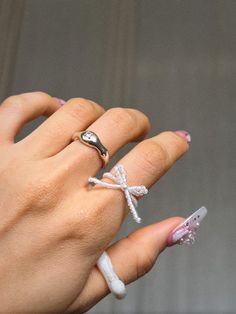 Handmade To Order.  🎀 Coquette aesthetic inspired beautifully crafted ribbon rings.  🎀 Various colours and styles available.  🎀 When handle with care when putting the rings on and off  as they are handmade and are delicate. Avoid contact with water and direct sunlight.  🎀 Made with high quality nylon wire & elastic, 2mm & 3mm seed & glass beads. NOTE: Only the Holographic beads are made with elastic wire. All the other styles are made with Nylon wire and does not stretch.  🎀All of our produ Coquette Rings, Rings Coquette, Coquette Ring, Korean Rings, Rings Korean, Rings Flower, Ribbon Ring, Flower Rings, Dainty Rings