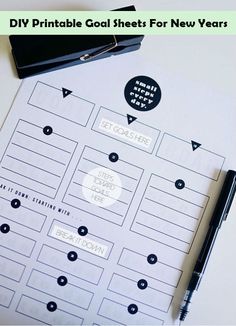 a black pen sitting on top of a white sheet of paper next to a clipboard