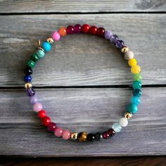 "Our happy Rainbow bracelet is bright and projects a feeling of happiness - made with a mix of gemstones such as: Malachite, Firestone, Turquoise, Coral, Jade, onyx, Amethyt, Rose Quartz, Tigereye, Garnet, Lapis etc. 14k solid gold beads are strung between the gemstones  Details: ✦ 14k solid gold Beads ✦ Stretch elastic ✦ 4mm gemstone beads ✦ 4mm solid gold beads  ✦ Our 14k gold is hallmared with VFD and 585 ( 14k) stamp ✦ NEW: Also available in Gold fill and Sterling silver ✦ Matching necklace Happy Rainbow, Candy Bracelet, Colored Gemstones, Rainbow Gemstones, Rainbow Bracelet, Gold Gift, Matching Necklaces, Gemstone Bracelet, Gold Beads