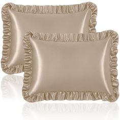 two satin pillows with ruffled edges