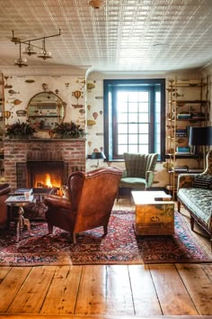 a living room filled with furniture and a fire place