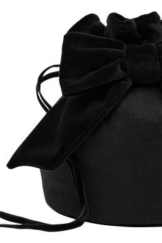 The Romeo Bag features a statement velvet bow and has a slouchy shape that gathers along the drawstring top. The inside is lined with quilted velvet stitching and small usable pockets. Soft mini bag Velvet bow Drawstring closure Internal usable pockets Lined with quilted velvet stitching Material: 100% European Flax™ certified linen Elegant Black Bag With Bow, Black Formal Bag With Bow, Formal Black Bag With Bow, Evening Top Handle Bag With Detachable Bow, Chic Black Bag With Bow, Black Bag With Detachable Bow, Transitional Dressing, Quilted Velvet, Drawstring Top