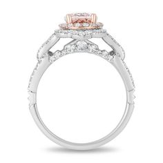 an engagement ring with two tone gold and white diamonds on the sides, set in 18k