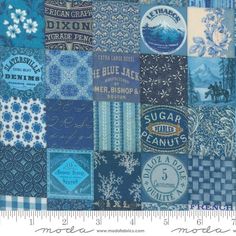 a blue patchwork quilt with various items on it