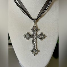 Statement Floral Cross Pendant On A Black Ribbon Necklace. Add A Touch Of Gothic Beauty To Your Look With This Vintage-Style Silver Tone Cross Necklace. The Necklace Features A Charming Floral Design And A Big Punk Cross That Hangs On An Adjustable Black Ribbon. Perfect For Any Occasion, This Necklace Is Ideal For Engagement, Wedding, Anniversary, Birthday, Christening, Confirmation/Communion, Valentine's Day, Father's Day, Mother's Day, Christmas, Graduation, Or Just For Yourself. The Necklace Silver Cross Pendant Jewelry For Party, Adjustable Silver Cross Pendant Jewelry, Handmade Black Cross Jewelry, Nickel-free Black Necklace, Gunmetal Cross Necklace Gift, Silver Cross Pendant Necklace For Party, Silver Cross Jewelry For Party, Silver Cross Necklace For Party, Silver Spiritual Choker Necklace