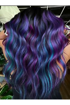 Are you ready to embark on a journey through a world of mesmerizing colors? Feast your eyes on this enchanting sight of long, blue and purple curled hair cascading down like waves of magic. Are you feeling inspired to add a splash of vibrancy to your style? Join the conversation and share your thoughts below! #BluePurpleCurls #HairDreamscape #ColorfulLocks #HairInspiration #ColorfulCurls #DreamyHair Dark Blue Hair Ombre, Purple And Teal Hair, Blue And Purple Highlights, Teal And Purple Hair, Purple And Blue Hair, Galaxy Hair Color, Blue And Purple Hair, Funky Hair Colors, Blue Purple Hair