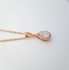 Dainty and small gold wedding pendant necklace with Cubic Zirconia tear drop set in an open setting. Will also work great as a bridesmaid necklace or gift. Created with 14k Gold plated brass bezel and surrounded by tiny cubic zirconia crystals, it is 12mm in size. I have put it onto a cubic zirconia detailed bail in gold plated brass and finished with a gold plated chain. Chain length is available in two sizes, 16 inches and 18 inches and both come with an additional 2 inches extension chain. Ma Gold Cubic Zirconia Teardrop Bridal Necklace, Rose Gold Drop Necklace For Wedding, Elegant Gold Pear-shaped Bridal Necklace, Gold Drop Bridal Necklace For Wedding, Rose Gold Teardrop Bridal Necklace, Gold Teardrop Bridal Necklace For Wedding, Rose Gold Teardrop Drop Necklace For Wedding, Wedding Rose Gold Teardrop Drop Necklace, Rose Gold Pear-shaped Necklace For Wedding