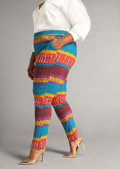 Style#4022OTA Our Talia African Print Stretch Pants are designed for the modern individual who values both flexibility and fashion. Meaning 'to bloom' in Arabic, these flattering skinny pants adapts to your lifestyle, providing the flexibility that you need without compromising on fashion. Wear with your favorite pair of boots, heels, or sneakers and pair with our Uyai stretch blazer. *Colors may look slightly different depending on the fabric used for construction* Description Stretch Woven Sli Multicolor Stretch Straight Pants, Multicolor Stretch Straight Bottoms, Vibrant Stretch Bottoms, Multicolor Stretch Straight Leg Pants, Orange Fitted Bottoms With Elastic Waistband, Fitted Orange Bottoms With Elastic Waistband, Multicolor Non-stretch Ankle-length Pants, Multicolor Stretch Ankle-length Pants, Fitted Orange Ankle-length Pants