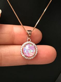 "Rose Gold Pink Fire Opal and CZ Necklace Bridal Opal Necklace / October Birthstone Necklace Metal: All Components Are Made From 14k Rose Gold Plated (vermeil) Sterling Silver Stone: 10mm Lab created Opal and Cubic Zirconia Measurement: pendant height is 21mm (0.83\") including bail and 13mm (0.51\") wide Choose Chain Length At Checkout Please feel free to Convo me with any questions before purchasing. Please view policy before purchasing Other Opal Necklaces can be found here https://www.etsy.c Luxury Pink Opal Elegant Necklace, Dazzling Rose Gold Necklace For Gift, Dazzling Rose Gold Necklace Gift, Party Jewelry With Birthstone, Sparkling Rose Gold Cubic Zirconia Necklace, Rose Gold Crystal Necklace With Sparkling Stones, Dazzling Rose Gold Round Necklaces, Dazzling Rose Gold Round Necklace, Dazzling Round Stone Jewelry For Wedding