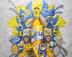 a bottle of liquor surrounded by various objects on a wallpapered background with blue and yellow accents