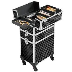 a black and silver rolling cart with two trays on it's sides, filled with various items