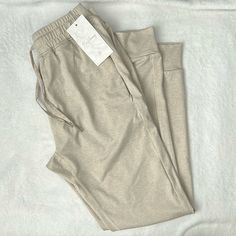 Here I Have A Brand New With Tags Pair Of Buff Bunny, Jogger Pants Or Pants However You Want To Call These. The Color Is An Oatmeal Color. With Pockets On The Side And Shown In Photos Drawstring As Shown In Photos. These Are A Size Large 66% Nylon 27% Polyester 7% Spandex. Khaki Bottoms For Loungewear, Beige Stretch Pants For Everyday Use, Beige Pants With Pockets For Lounging, Beige Lounging Pants With Pockets, Comfortable Beige Pants For Everyday Wear, Comfortable Everyday Beige Pants, Stretch Khaki Pants For Loungewear, Beige Sweatpants With Pockets For Lounging, Beige Stretch Sweatpants For Loungewear