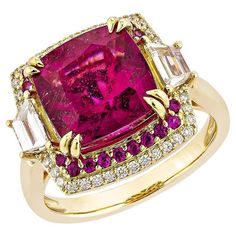 Sunita Nahata showcases an exquisite diamond studded Rubellite ring that exudes grace and elegance. This exquisite 18Karat yellow gold ring is ideal for any special occasion because it combines traditional elegance with modern flair. Rubellite Cocktail Ring in 18Karat Yellow Gold with Ruby and Diamond. Rubellite: 5.73 carat, 10X10mm size, cushion shape. Ruby: 0.41 carat, 1.20mm size, round shape. White Diamond: 0.17 carat, 5.20X3.00mm size, trapezoid shape, G color, VS clarity. White Diamond: 0.21 carat, 0.95mm size, round shape, G color, VS clarity. Gold: 6.21g, 18Karat Yellow Gold. RBL73 Rubellite Ring, Trapezoid Shape, Golden Rings, Alexis Bittar Jewelry, Golden Ring, Jewelry Luxury, Animal Coloring, Deco Floral, Royal Jewelry