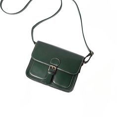 This small messenger bag is crafted with the finest soft leather for the utmost comfort and durability. Its slim design ensures you can carry all the essentials without the bulk and its adjustable shoulder strap provides the perfect fit. Ideal for students and commuters, this leather bag offers a practical and stylish solution. Size: L 19cm H 16cm W 7cm Classic Green Shoulder Bag With Mobile Phone Holder, Classic Green Shoulder Bag With Phone Holder, Green Leather Shoulder Bag For Mobile Phone, Classic Travel Satchel With Single Shoulder Strap, Classic Green Mobile Phone Bag, Green Leather Bag With Mobile Phone Pocket, Green Leather Mobile Phone Bag, Daily Use Satchel Saddle Bag With Single Strap, Classic Crossbody Shoulder Bag For School